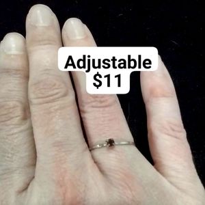 Vintage style adjustable silver ring with garnet colored stone